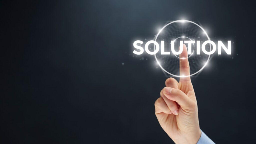 Image of a human hand touching the word solution